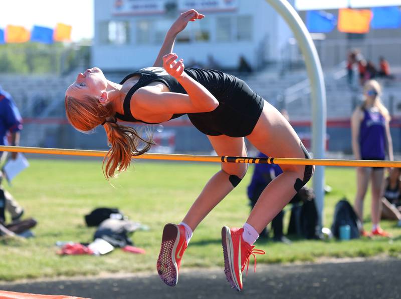 Kaneland’s Allainna Siwy clears the bar in the high jump Friday, May 15, 2026, during the Class 2A girls track sectional at Genoa-Kingston High School.