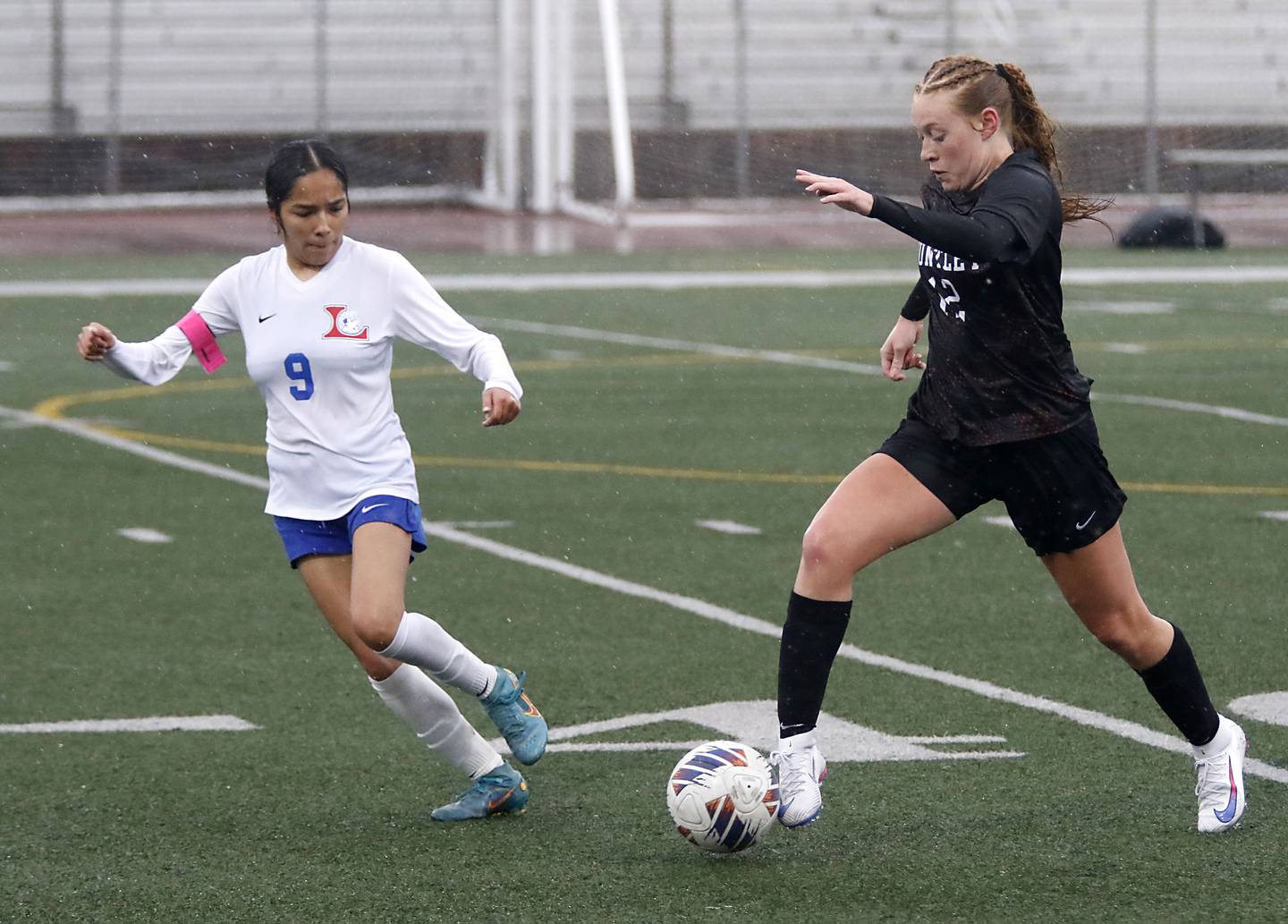 Huntley’s Emma Emricson (right) brings the ball up the field against Larkin’s Naila Nunez (left) during a nonconference soccer match on Thursday, March 26, 2026, at Huntley High School.
