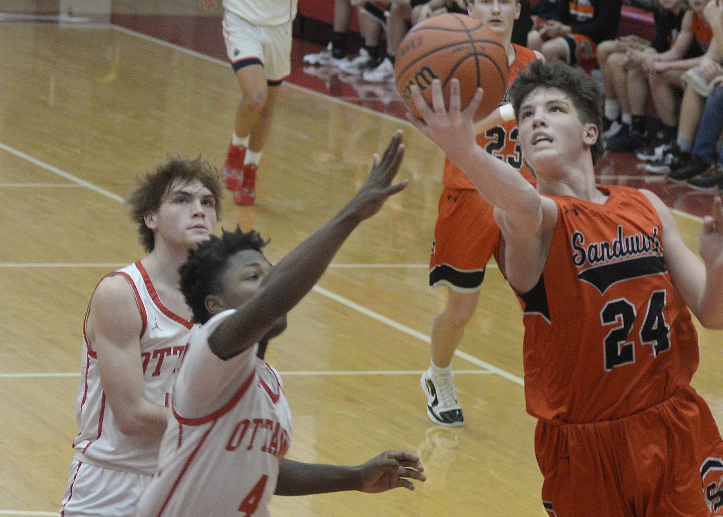 Ottawa’s Keevon Peterson prepares to stop Sandwich’s Evan Gottlieb from a layup in the second period on Tuesday, Jan. 3, 2023 at Ottawa High School.