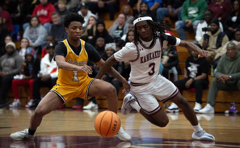 Kankakee's Cedric Terrell III, right, and Richards's Sammy Childs, left, look to control a loose ball in a game in the Kankakee Holiday Tournament at Kankakee High School on Saturday, December 27, 2025.