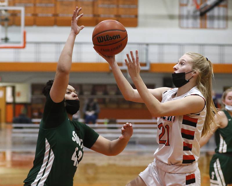Crystal Lake Central's Courtney Schober, right, drives to the basket against Crystal Lake South's Nicole Molgado during a Fox Valley Conference game Wednesday, Jan. 26, 2022, between Crystal Lake South and Crystal Lake Central at Crystal Lake Central High School.