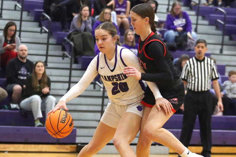 Huntley’s Evie Freundt, right, guards Hampshire’s Sadie Van Horn in varsity girls basketball on Wednesday, Feb. 11, 2026, at Hampshire High School in Hampshire.