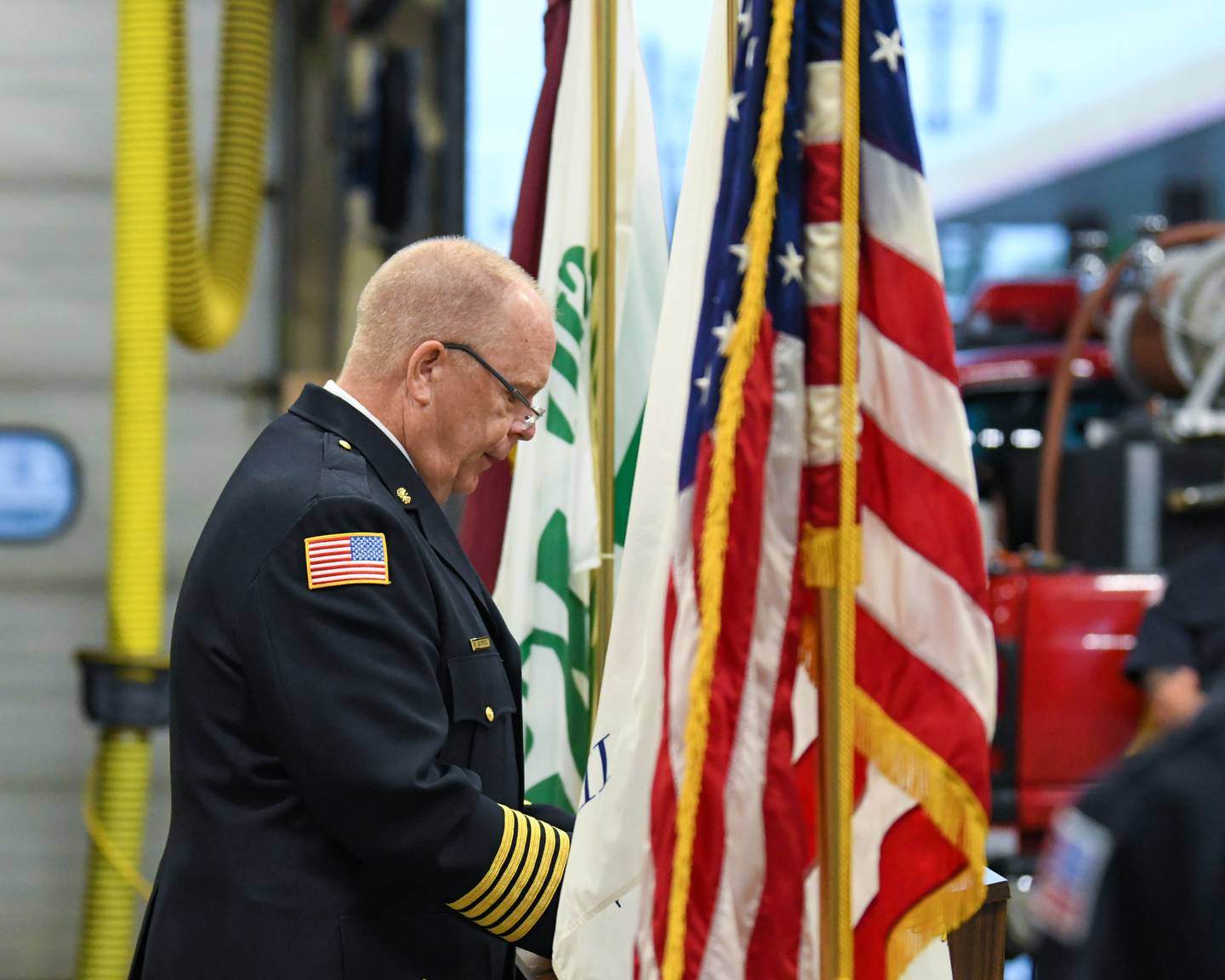 On Sunday Sep. 11th DeKalb's fire chief Mike Thomas talks during a 9-11 remembrance ceremony held at station one in DeKalb.