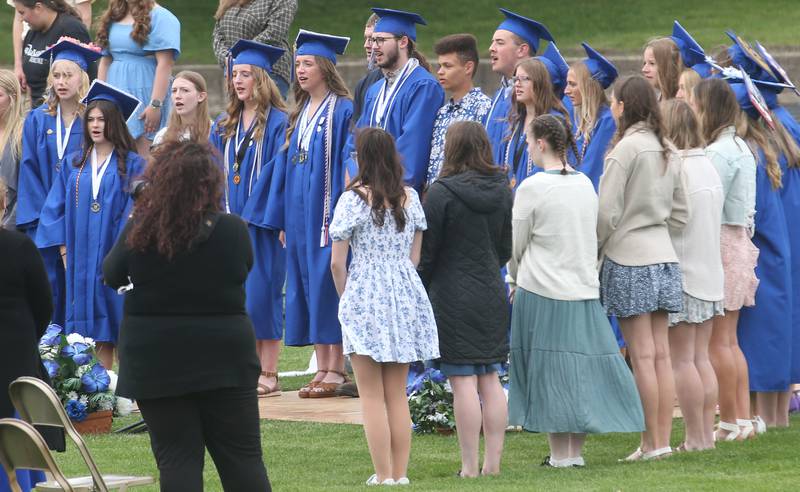 Princeton High School graduates sing in the concert choir during the 156th annual Commencement on Saturday, May 17, 2025 at Bryant Field.