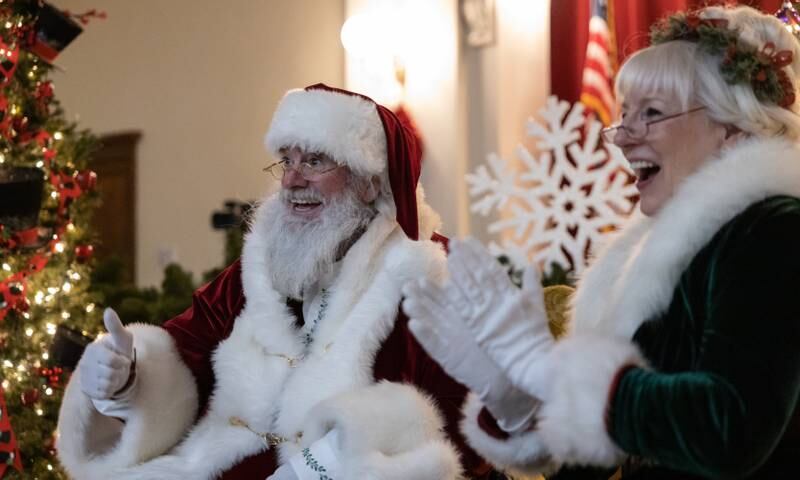 Santa and Mrs. Claus greet the crowds waiting for a chance to take pictures with them during Christmas festivities in La Grange on Saturday, Dec. 3, 2022.