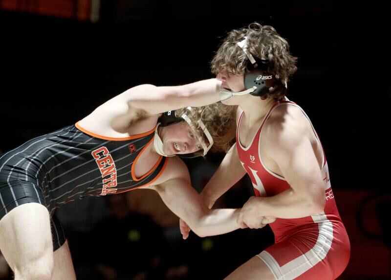 Crystal Lake Central’s Owen Battaglia, left, battles Huntley’s Lucas Bittman in a 175-pound bout in varsity wrestling at Crystal Lake Friday.  Bittman won the match.
