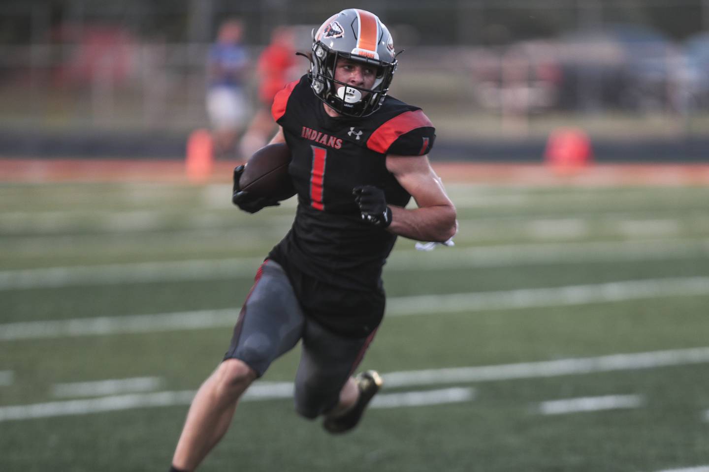 Minooka receiver Trevor Hudak carries out of the backfield on Friday, Aug. 27, 2021, at Minooka Community High School in Minooka, Ill.