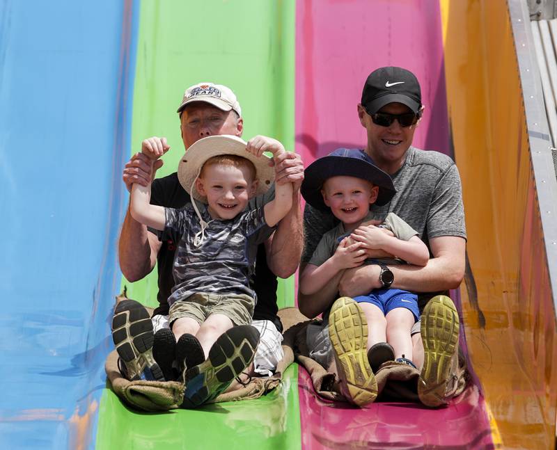 Families enjoy the large slide during the Spring Fling in Westmont, Ill. on Sunday, May 29, 2022.