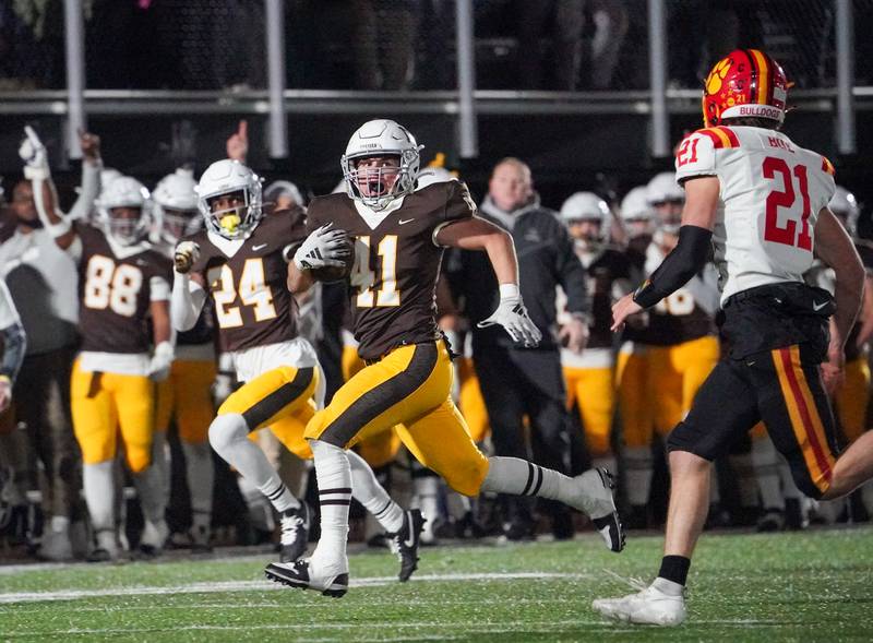 Mt. Carmel's Matthew Mucha (41) runs back an interception against Batavia during a class 7A semifinal football playoff game at Mt. Carmel High School in Chicago on Saturday, Nov 18, 2023.