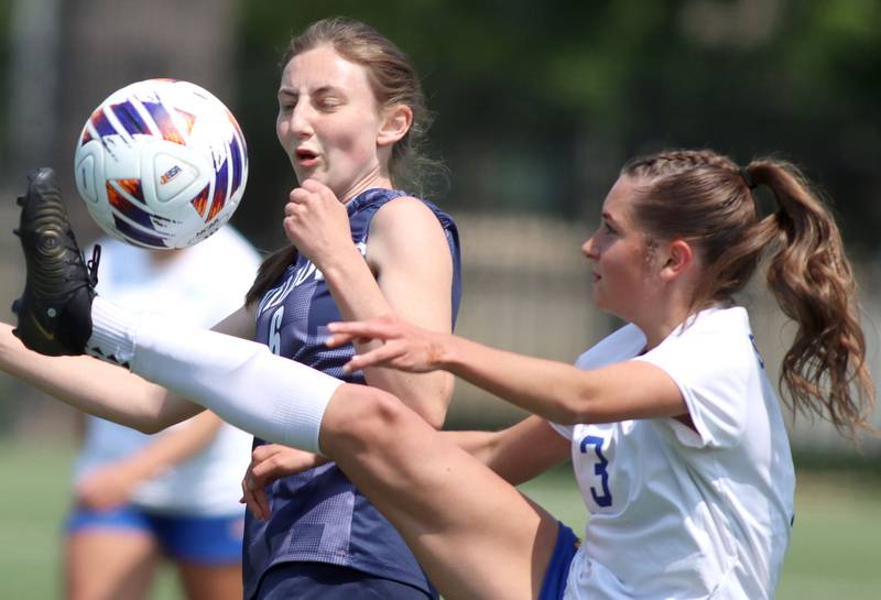 Johnsburg’s Charlie Eastland, front, gets the ball ahead of Willows Academy’s Tess Anastasi in IHSA Class 1A Supersectional soccer action at Dominican University in River Forest on Saturday, May 31, 2025.