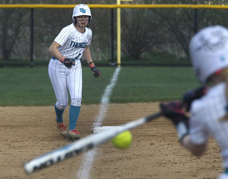 Woodstock North's Maddie Nordahl looks for an opportunity to score a run during a Kishwaukee River Conference softball game against Richmond-Burton on Thursday, April 16, 2026, at Woodstock North High School.