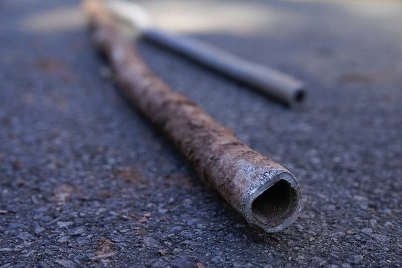 FILE - Lead water pipes pulled from underneath the street are seen in Newark, N.J., Oct. 21, 2021. (AP Photo/Seth Wenig, File)