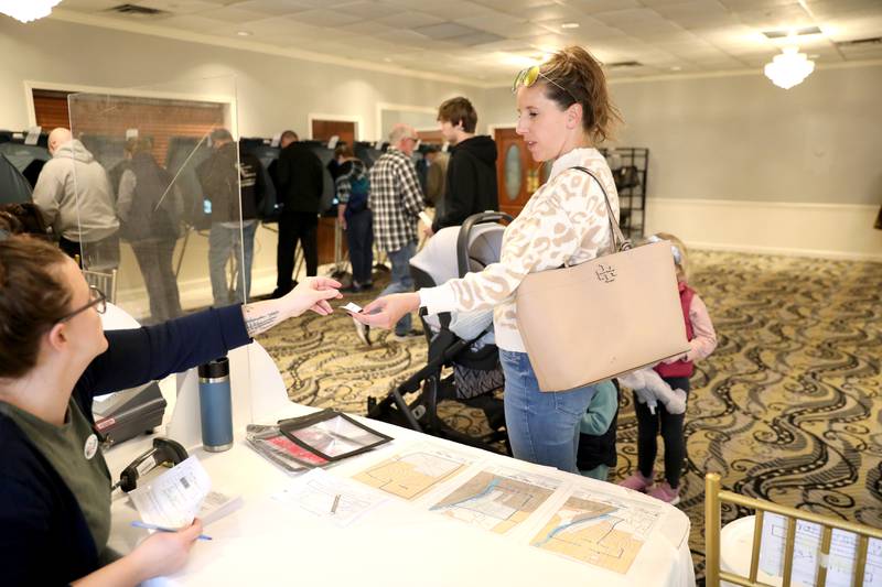 Lauren Olson brought her children, baby Will, Colin, 3, and Brooklyn, 5, to vote in the General Election at the Lincoln Inn and Banquets in Batavia on Tuesday, Nov. 8, 2022.