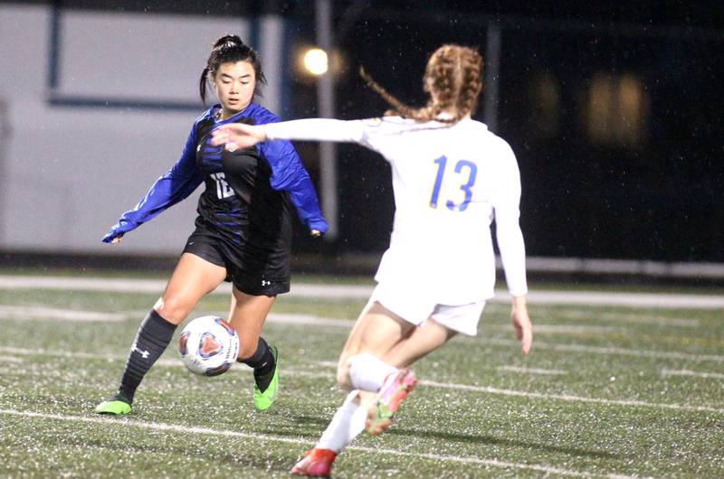 Geneva’s Leyna Yonehara (16) goes after the ball during a home game against Lyons Township on Thursday, March 24, 2022.