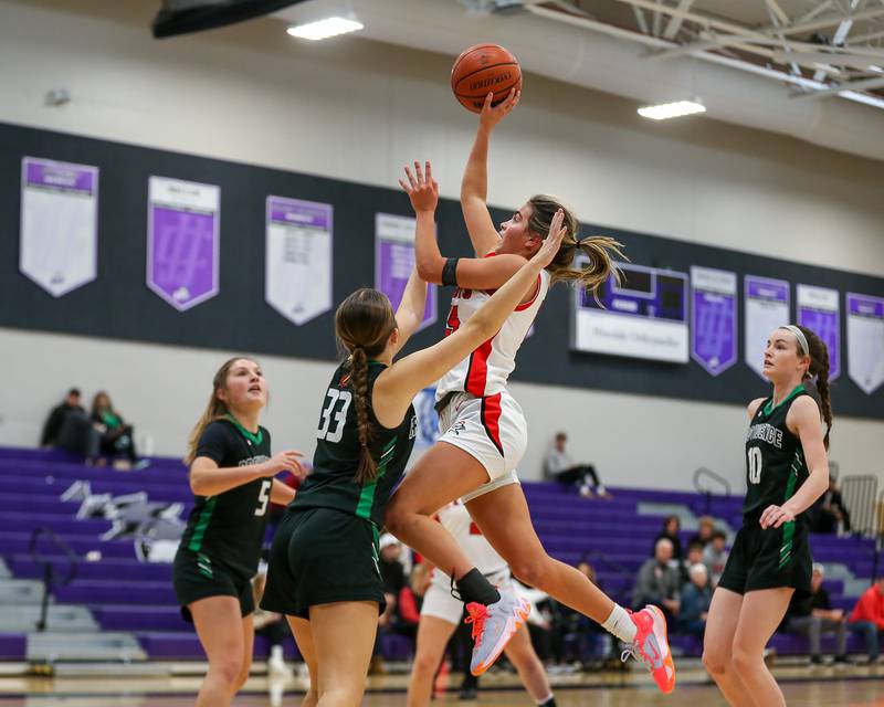 Lincoln Way Central's Gianna Amadio (15) shoots over Providence's Claire Wadja (33) in the WJOL Tournament Championship game. Nov 18, 2023.
