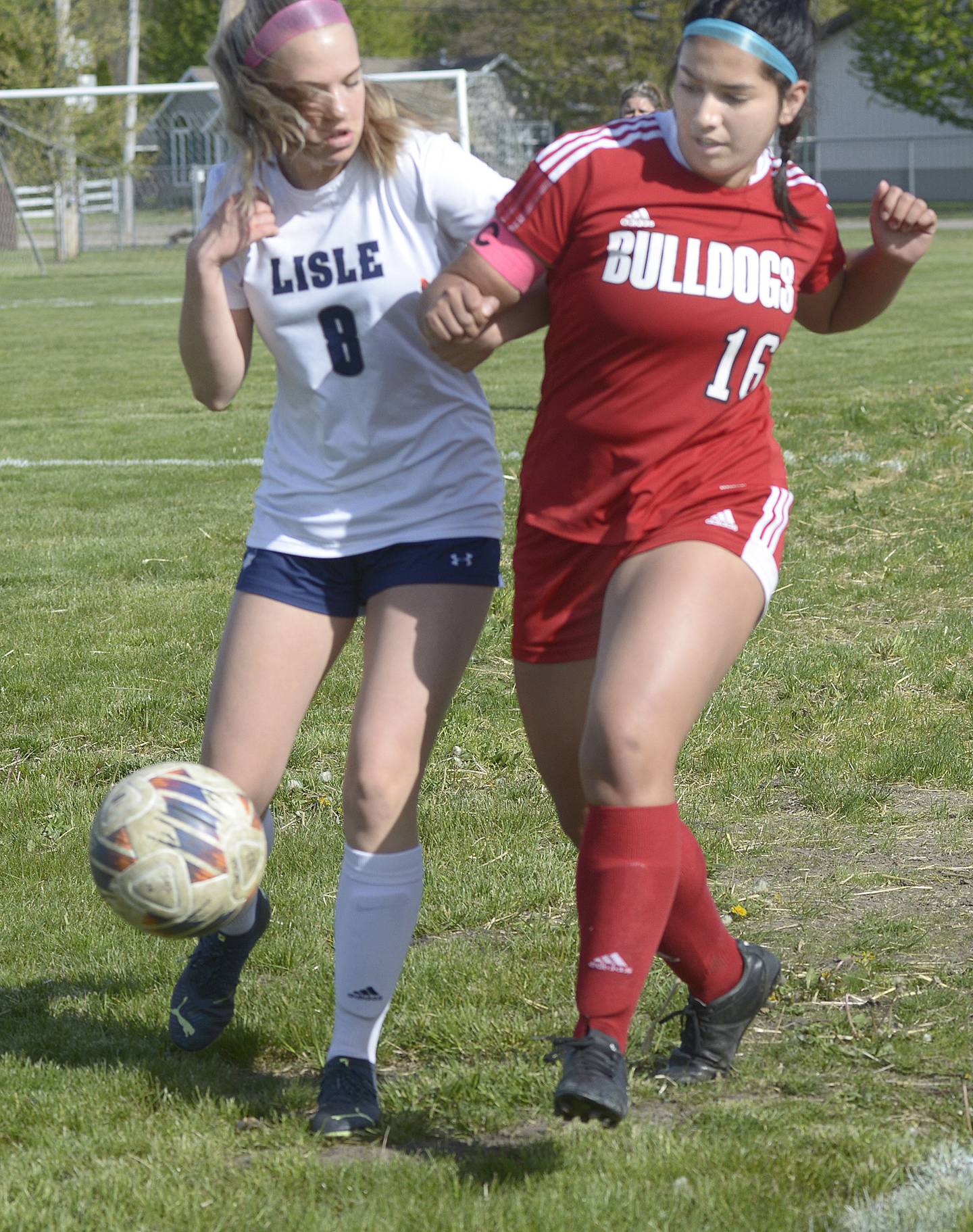 Lisle’s Ally Doering and Streator’s Zuzu Gonzalez give chase to a loose ball on Thursday April 25, 2024 at James Street Recreation Area in Streator.