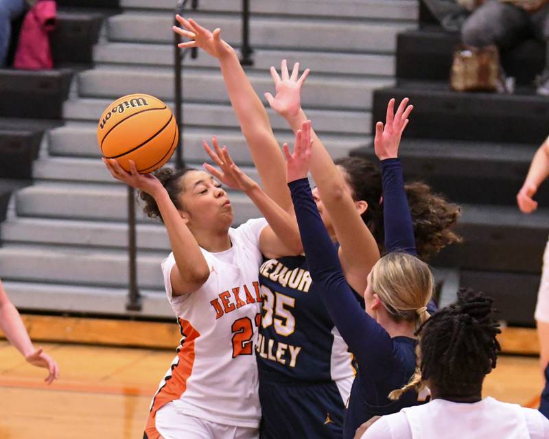 DeKalb's Alicia Johnson (21) makes a basket while being defended by Neuqua Valley's Nya Vazifdar, center, and Neuqua Valley's Taylor Dobry during the game on Thursday Feb. 6, 2025, held at DeKalb High School.
