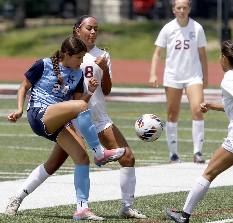 Nazareth Academy's Daniella Berruti passes the ball as she is defended by St. Ignatius College Prep's Sofia Knoepp during a IHSA Class 2A State Girls Soccer semifinal match on Friday, June 6, 2025, at North Central College in Naperville.