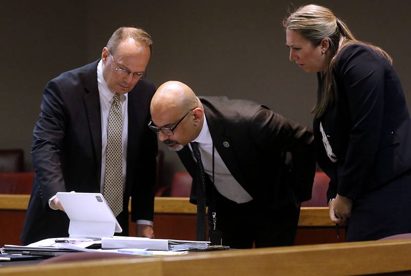 Defense Attorney Clay Mitchell, Assistant State’s Attorney Ashur Youash and Assistant State’s Attorney Maggie O'Brien review a video during Charles Gozzola’s trial on Monday, April 29, 2024, in front of Judge Mark Gerhardt. Gozzola is charged with aggravated battery in a public place, a Class 3 felony, and domestic battery with physical contact stemming from an alleged incident in Crystal Lake in January. In 2002, he was convicted of killing his then-wife and served prison time. I like this photograph because it is a different courtroom image that brings to life the workings of a court.