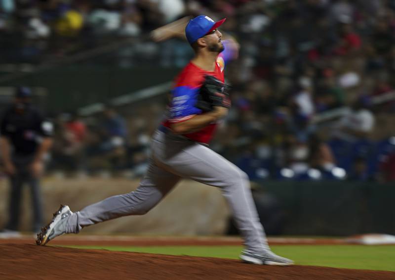 Puerto Rico's pitcher Eric Stout delivers against the Dominican Republic during a Caribbean Series baseball game in Santo Domingo, Dominican Republic, Saturday, Jan. 29, 2022.