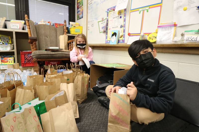 Four grade students at Taft Elementary School in Joliet coordinated a school-wide sock collection drive for MorningStar Mission. Nearly 400 pairs of new socks were collected. Taft fourth graders Lily Richter and Anthony Solache help package up the donated socks.