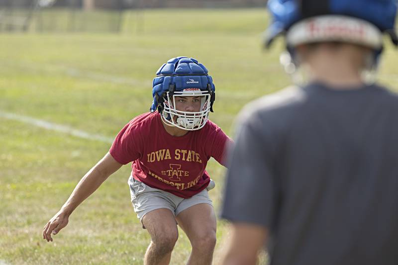 Newman players run through drills during first day of football practice Monday, August 7, 2023.