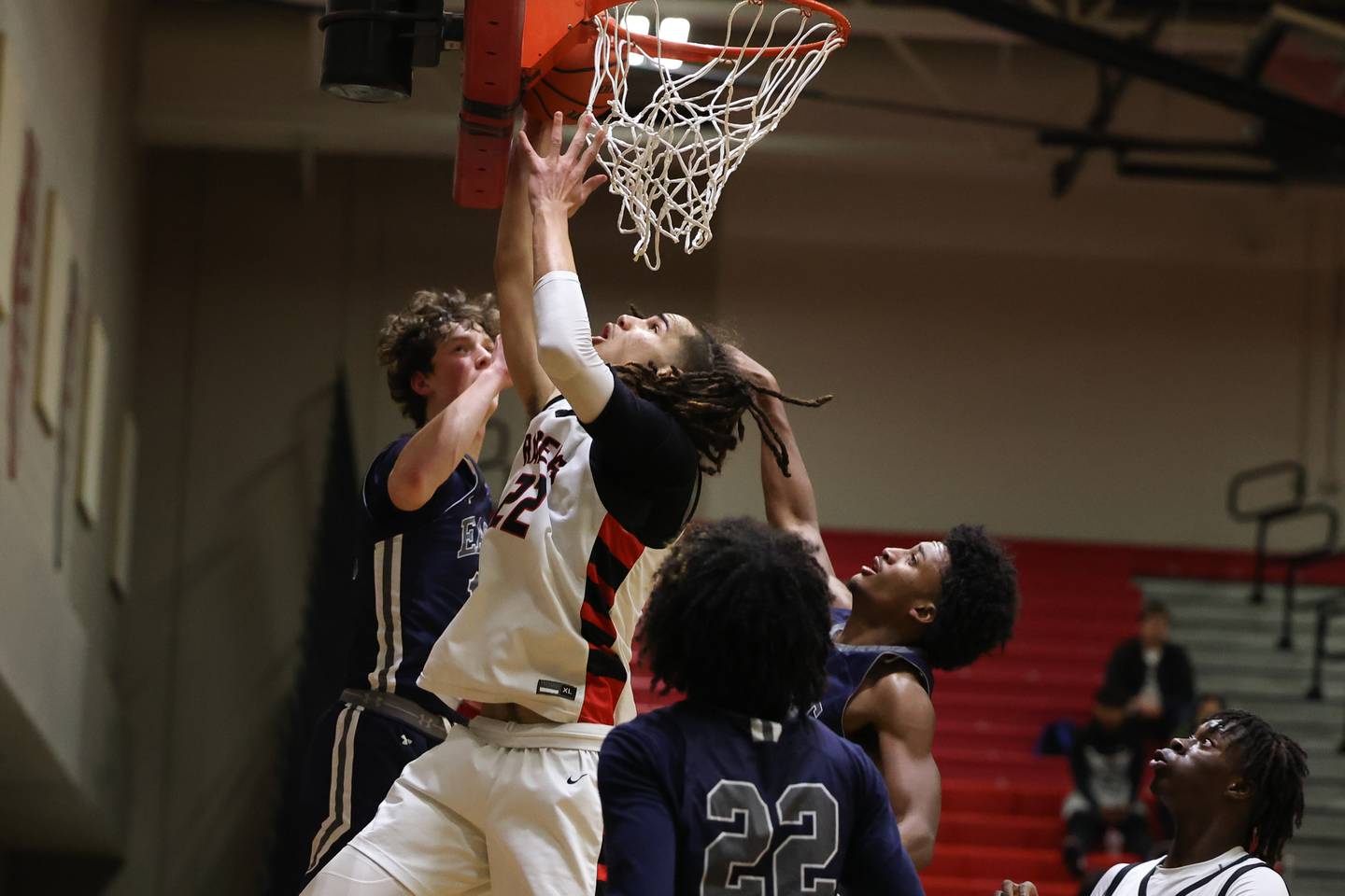 Bolingbrook’s Donaven Younger battle for the shot against Oswego East.