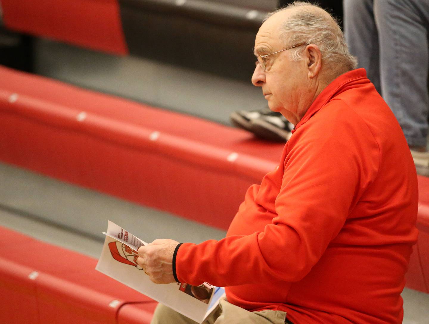 Frank Colmone watches teams play during the 50th annual Colmone Classic on Monday, Dec. 9, 2024 at Hall High School. Colmone was a former athletic director at Hall High School.