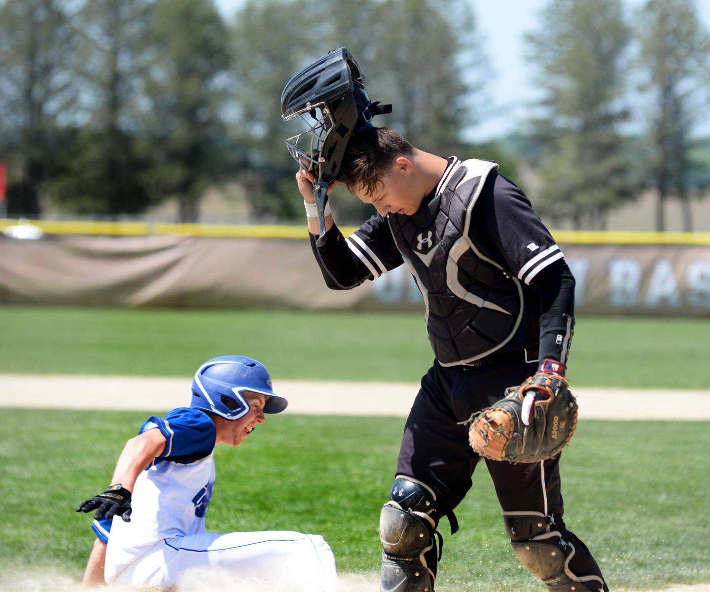 Rock Falls catcher Isaiah Kobbenman reacts as a Rockford Christian plater scores the winning run in the bottom of the eighth inning during the championship game at the 2A Oregon Regional on Saturday, May 21. The Rockets lost the game 5-4.
