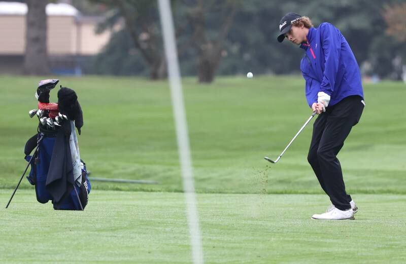Burlington Central’s Camden Sarallo hits a shot from the fairway Wednesday, Sept. 27, 2023, during the Class 2A boys golf regional at Sycamore Golf Club.