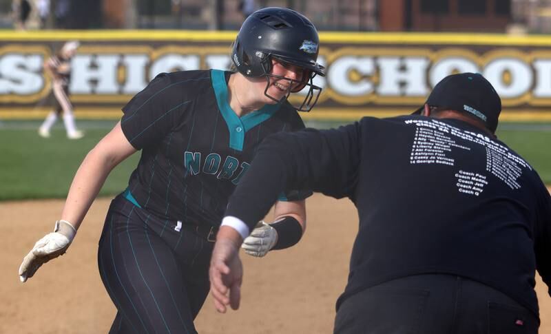 Woodstock North’s Casey Vermett rounds third base on her second of two home runs against Jacobs in varsity softball at Algonquin Friday night.