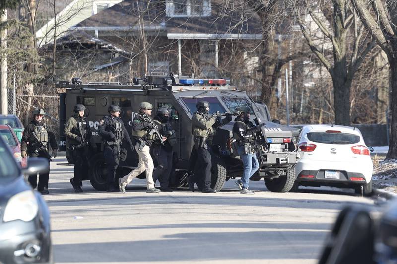 A SWAT team sets up in the 500 block of Irving Street in Joliet after in response to what Joliet police said was  a possible barricade situation inside a home on Thursday, Jan. 9, 2024.