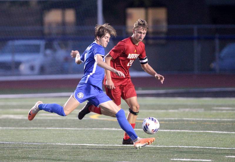 Geneva’s Ben Schuemer (left) gets a shot on goal as Batavia’s Alexander Marshall looks to defend during a Tri-Cities Night game at St. Charles North High School on Thursday, Sept. 21, 2023.
