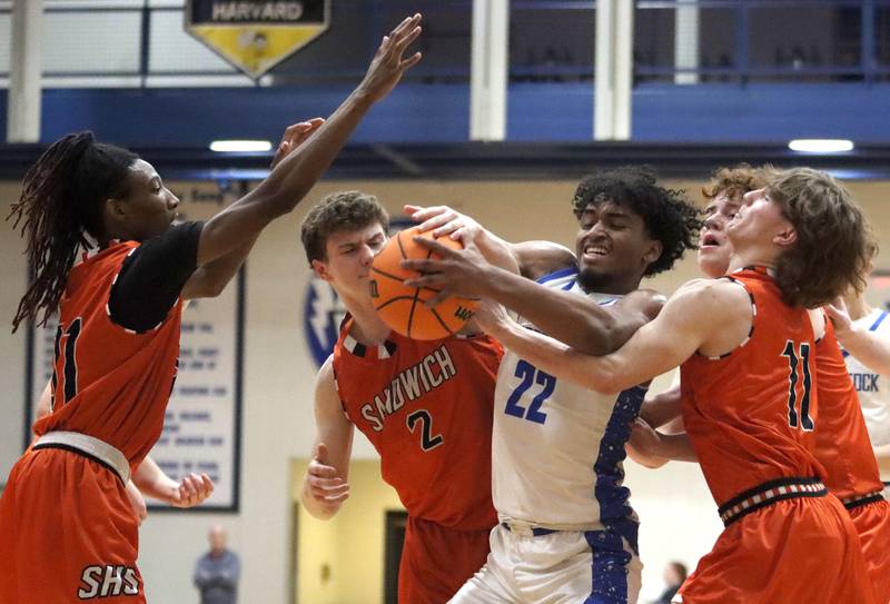 Woodstock’s Tony Grzetic battles for the ball against Sandwich in varsity boys basketball on Tuesday, Feb. 11, 2025, at  Woodstock High School in Woodstock.