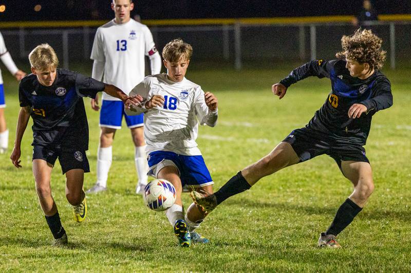 Carson Harper (21) of Somonauk/Leland/Newark pushes away Colten Sargent (18) of Hinckley-Big Rock as he fights over possession of ball with Landon Johnson (20) of Somonauk/Leland/Newark in the Little Ten Conference Championship match on Thursday, Oct. 9, 2025 at Hinckley-Big Rock School in Hinckley.
