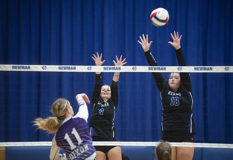 Newman’s Katie Brennan (left) and Kennedy Rowzee goes up to block a shot by Dixon’s Ella Govig Monday, Aug. 29, 2022.