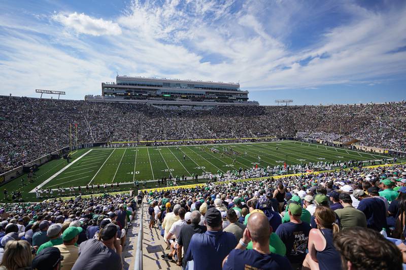 FILE -Notre Dame and Marshall play during the first half of an NCAA college football game in South Bend, Ind., Sept. 10, 2022. The athletic directors who lead the schools that play Division I college football at the highest level want the sport to continue be governed by the NCAA — if that governance can be streamlined. LEAD1, an association of Football Bowl Subdivision ADs, convened 105 of its 131 members Wednesday, Sept. 14, for a meeting that focused mostly on how best to govern major college football. (AP Photo/Michael Conroy, File)