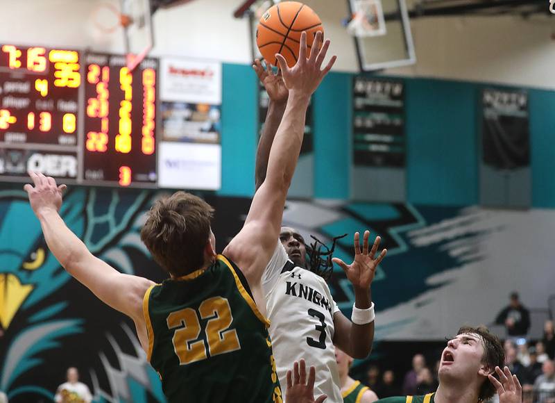 Kaneland's Marshawn Cocroft shoots the ball over Crystal Lake South's Nick Stowasser during the IHSA Class 3A Woodstock North Sectional final basketball game on Friday, March 6, 2026, at Woodstock North High School.