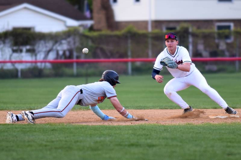 Bradley-Bourbonnais' Kason Bynum, right, fields a pickoff throw at second base as Lincoln-Way West's Conor Essenburg dives back during a game at Bradley-Bourbonnais Thursday, May 1, 2025.