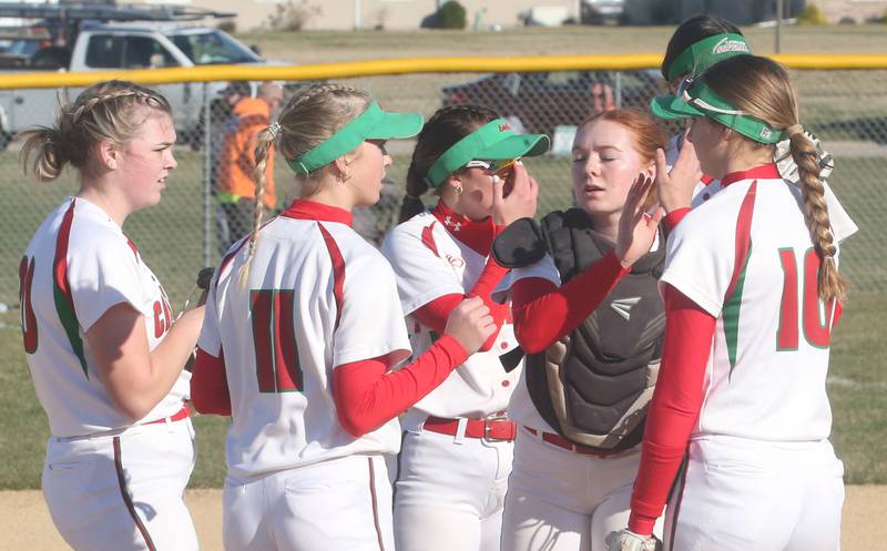 Members of the L-P girls softball team gather on the mound while playing Princeton on Tuesday, March 19, 2024 in Princeton.
