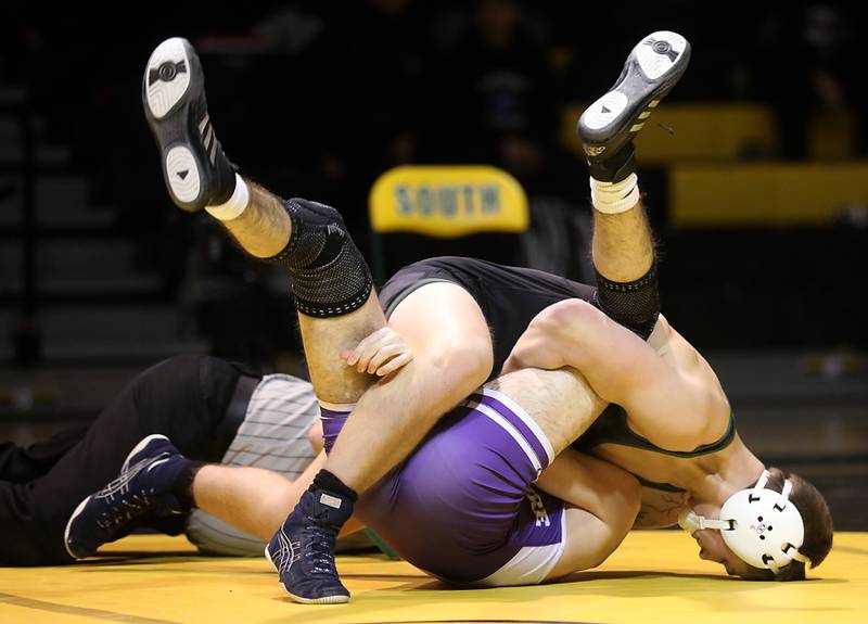 Crystal Lake South’s Nate Randle tries to pic Hampshire’s Jacob Dhaka during the 138-pound match of a Fox Valley Conference wrestling meet on Thursday, Jan. 15, 2026, at Crystal Lake South High School.