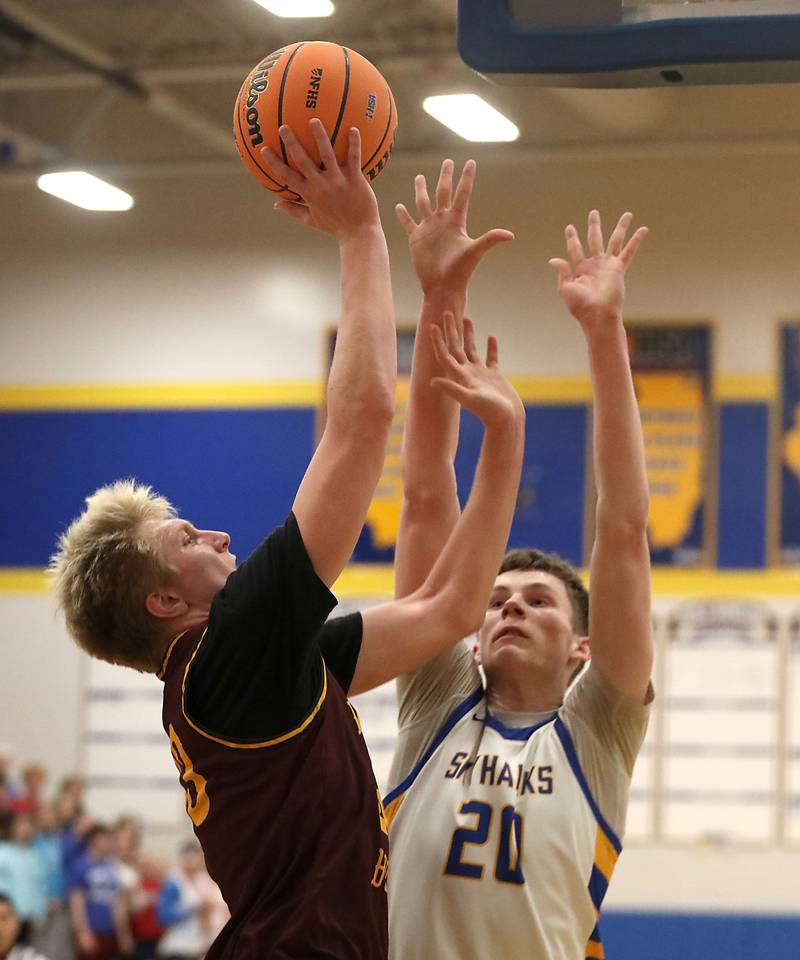 Richmond-Burton's Luke Robinson shoots the ball over Johnsburg's Josh Kaunas during the IHSA Class 2A Johnsburg Regional Championship boys basketball game on Friday, February, 27, 2026, at Johnsburg High School.