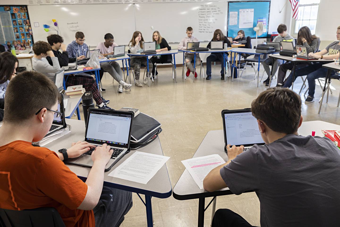 Sophomores at Sterling High School work on a paper discussing the artificial intelligence program ChatGPT Thursday, April 6, 2023.