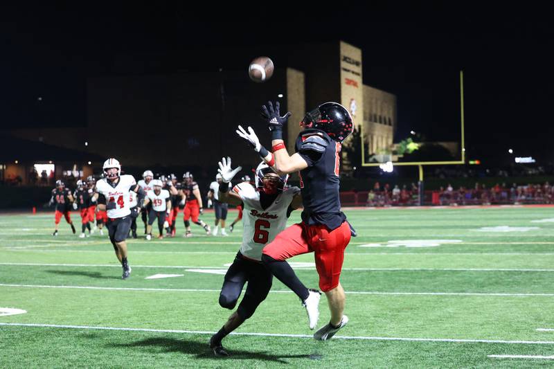 Lincoln-Way Central's Lucas Andresen catches a first down pass ahead of Bradley-Bourbonnais' Rontez Smith during the Knight's 28-20 victory over Bradley-Bourbonnais on Friday, Oct. 3, 2025.