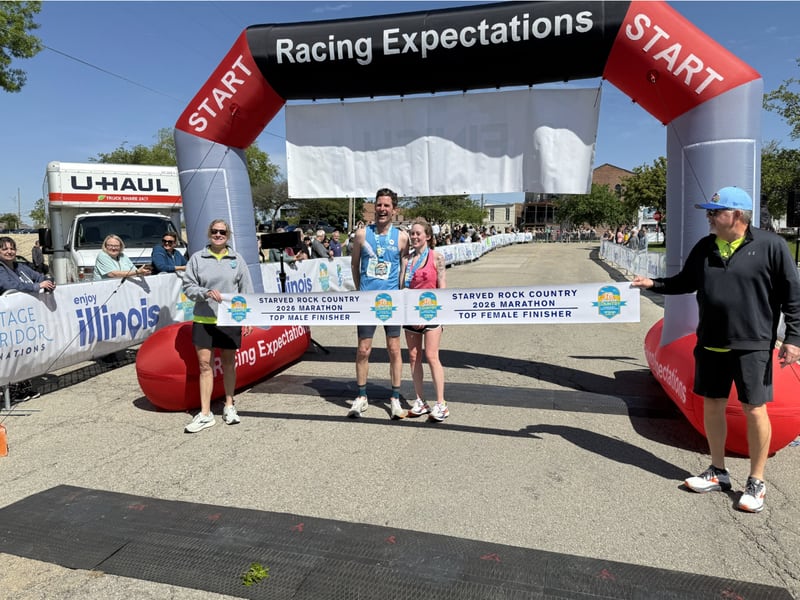 Jens Conzen (left) and Sydney Watkins (right) celebrate being the first in their categories to finish the 2026 Starved Rock Country Marathon on Saturday, May 9, 2026 in Ottawa.