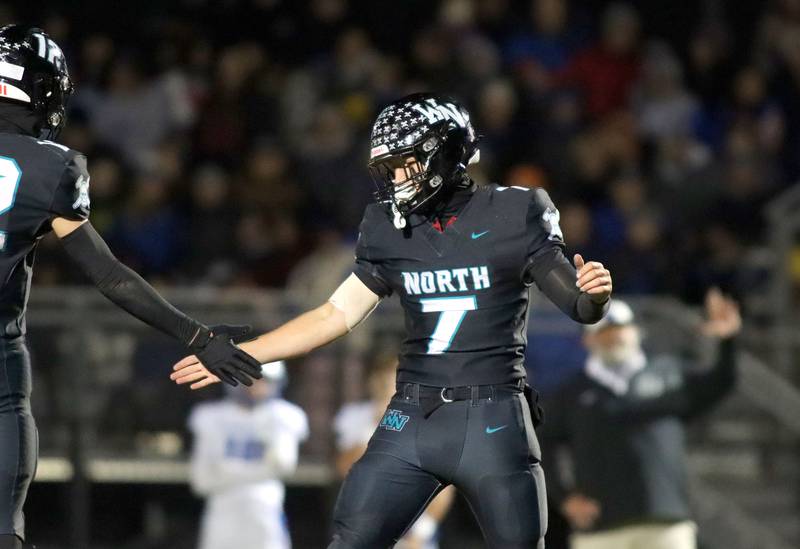 Woodstock North’s Parker Halihan is greeted after a touchdown against Woodstock in varsity football at Woodstock North High School on Friday, October 24, 2025.