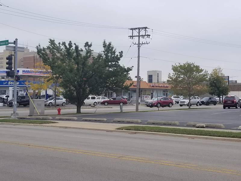 Cars wait in line on Republic Avenue in Joliet on Saturday, September 26, 2020,  for their turn to receive $20 in free gas at Marathon Gas in Joliet. New Covenant Worship Center in Joliet gave away $20 in free gas to the first 150 cars on that day.