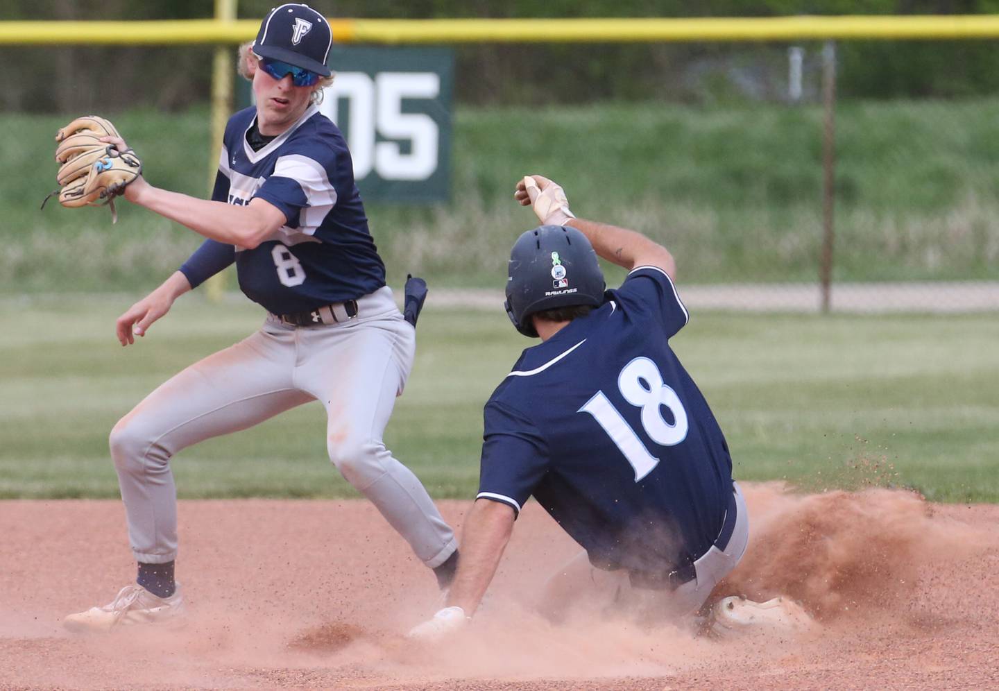 Fieldcrest's Jordan Heider takes a throw on a steal attempt at second base by Prairie Centra's Clayton Behler in a game last season at Fieldcrest Middle School in Wenona.