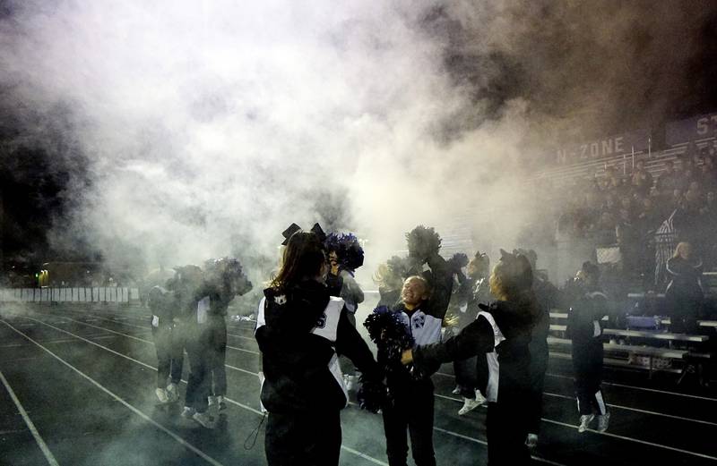 Downers Grove North's cheerleaders celebrate during the IHSA Class 7A playoff football game Friday, Oct. 31, 2025 in Downers Grove.