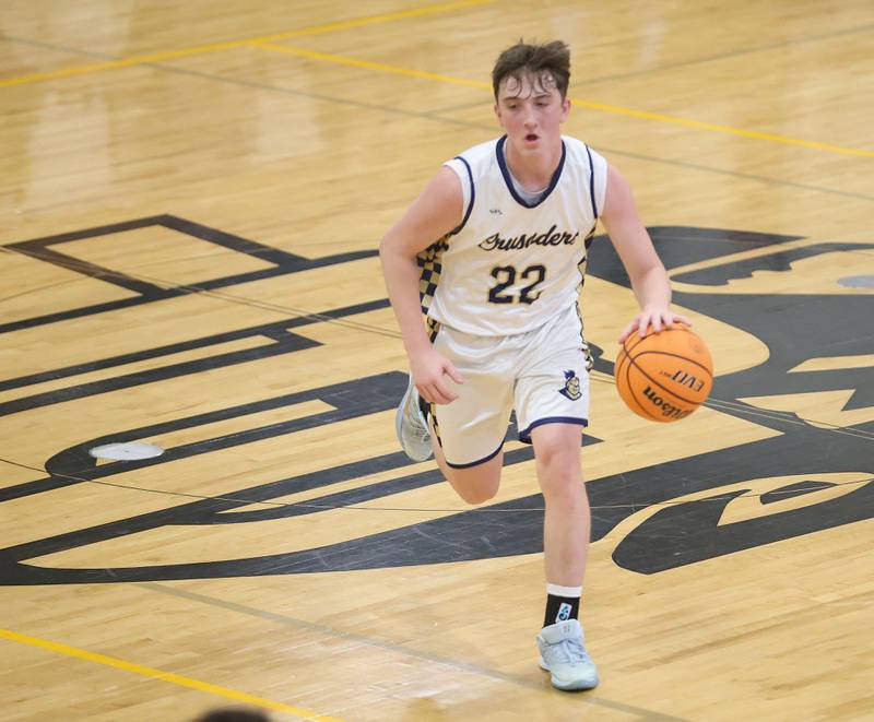 Marquette's Griffin Dobberstein dribbles down the court during the Tri-County Conference Tournament on Monday, Jan. 26, 2026 at Putnam County High School